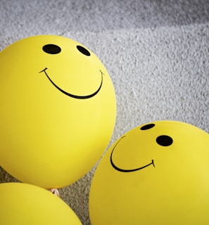 yellow smiley emoji on gray textile