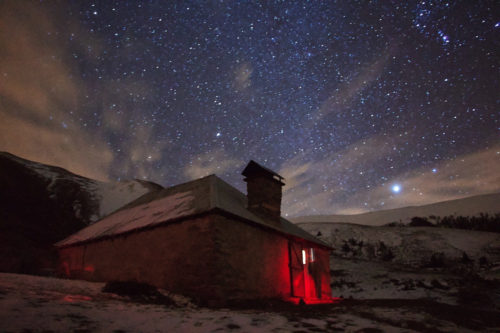brown house under starry night