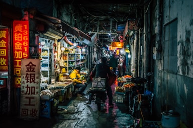 street photography,how to photograph shanghai's hidden neon networks.; people in store during nighttime