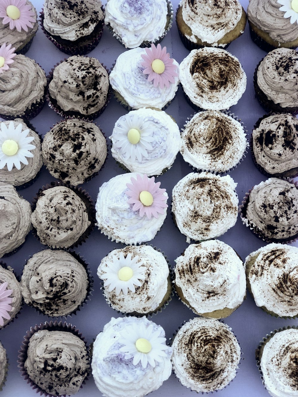 white and yellow flower on brown cookies