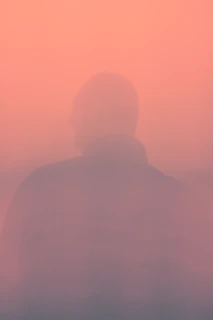 man in white shirt standing