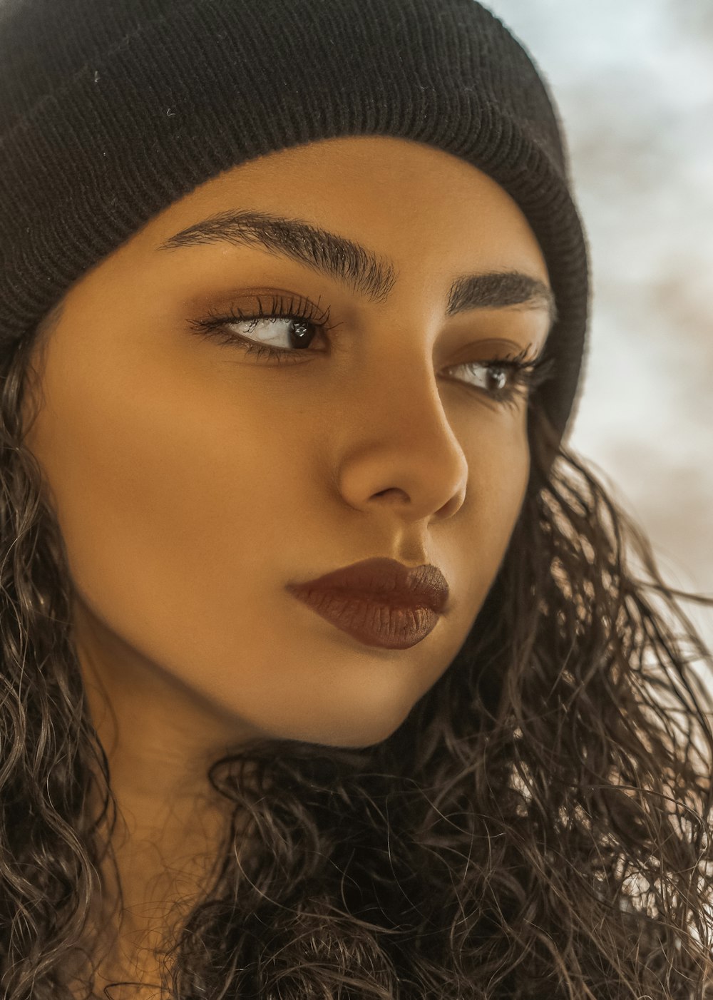 woman in black knit cap