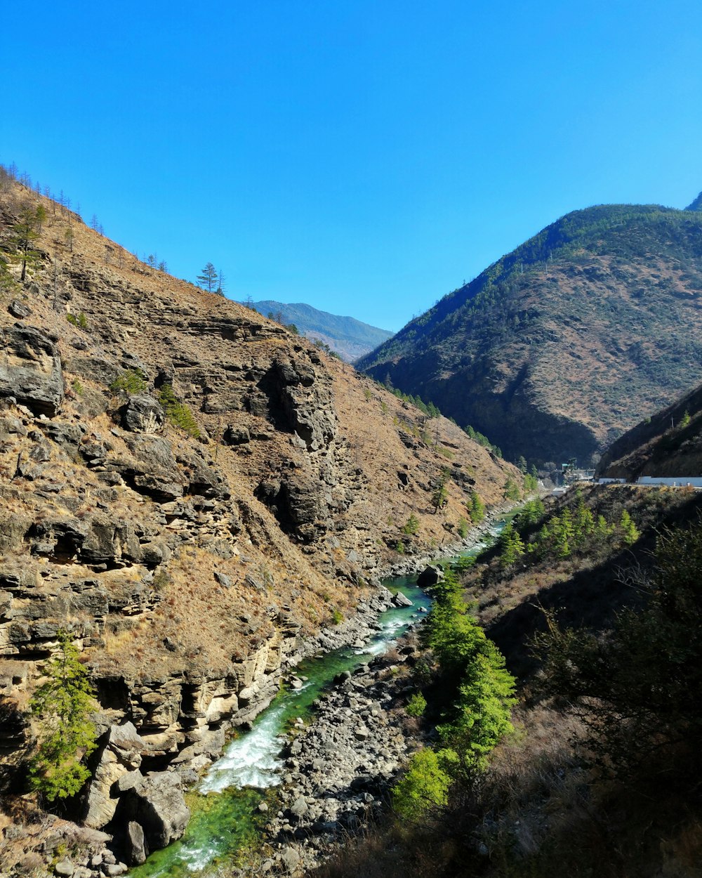 green and brown mountain under blue sky during daytime