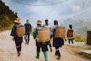 people walking on brown sand during daytime