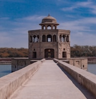 gray concrete building near body of water during daytime