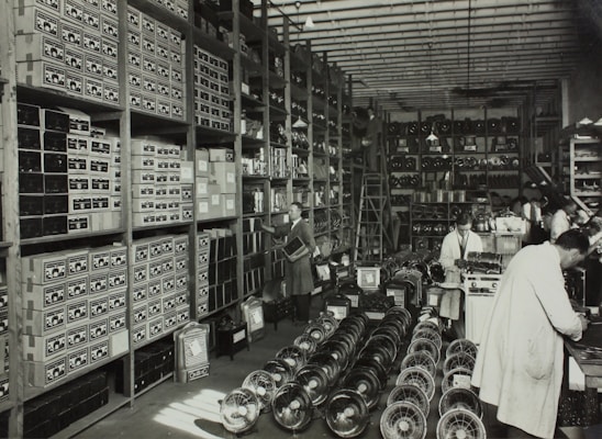 Rows of electrical relays and switches neatly organized on shelves in a warehouse.
