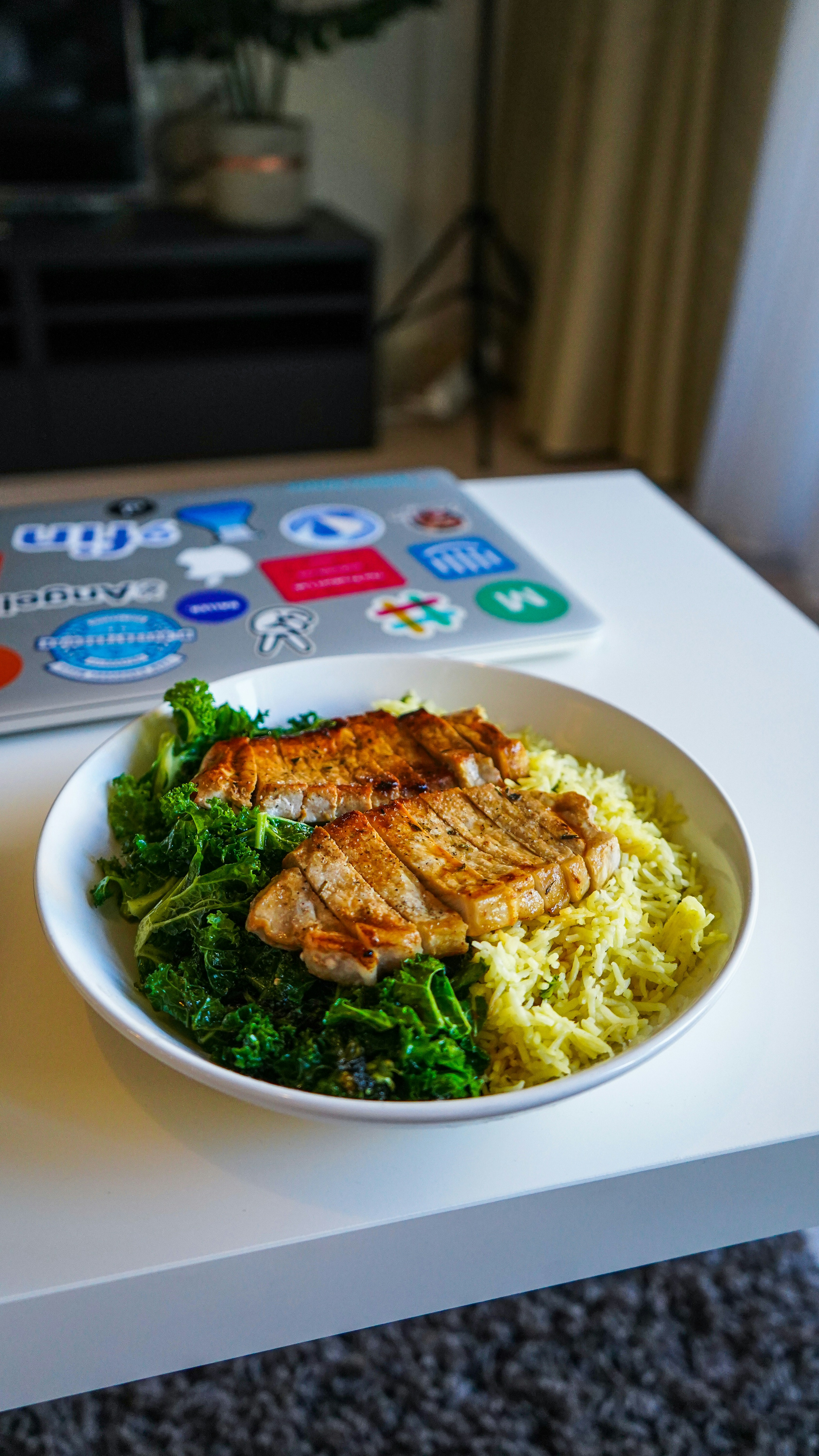 white ceramic plate with pasta and meat dish