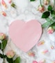 pink heart shaped paper on white and pink floral textile