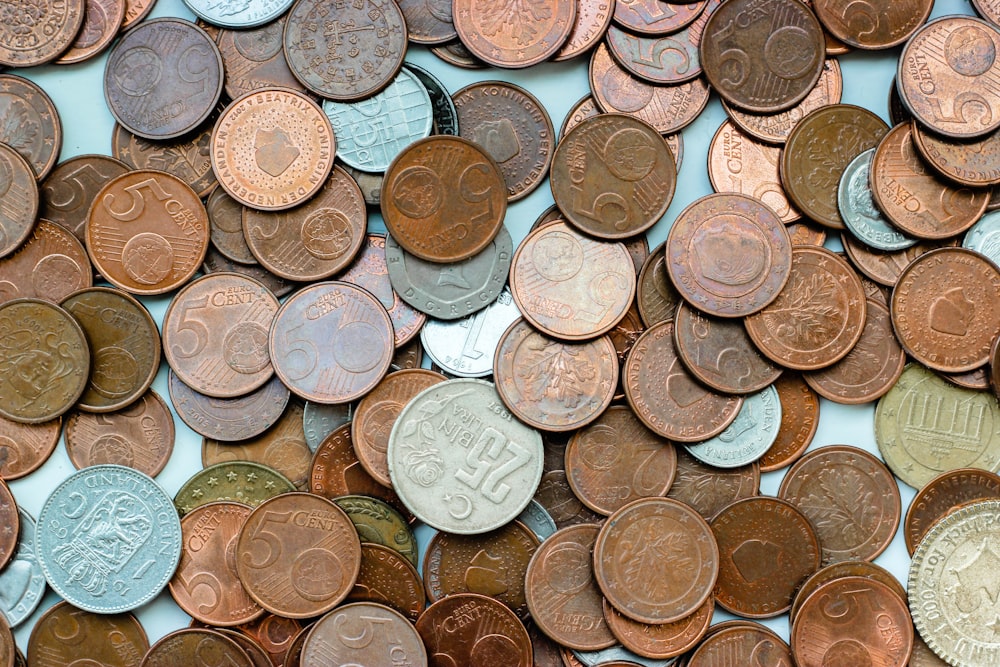 brown round coins on white table