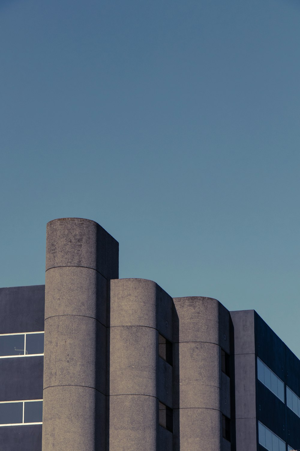 gray concrete building under blue sky during daytime