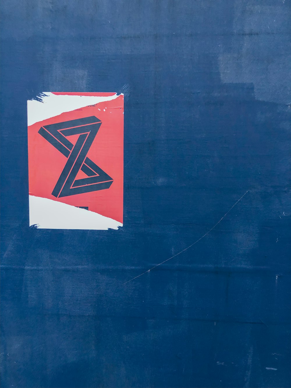 red and white flag on blue wall