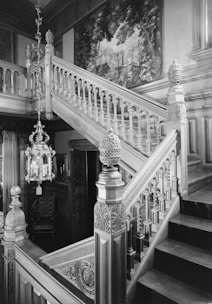 A beautifully restored wooden staircase in a historic manor.