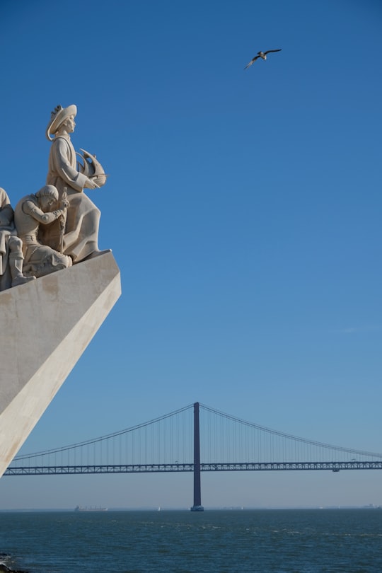 gray concrete statue under blue sky during daytime in Padrão dos Descobrimentos Portugal