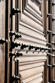 Close-up of a craftsman installing a wooden interior door in a modern home.