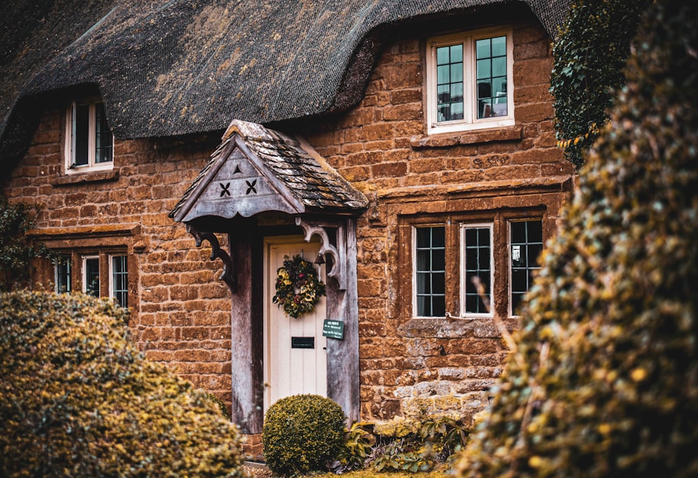 brown brick house with white wooden door