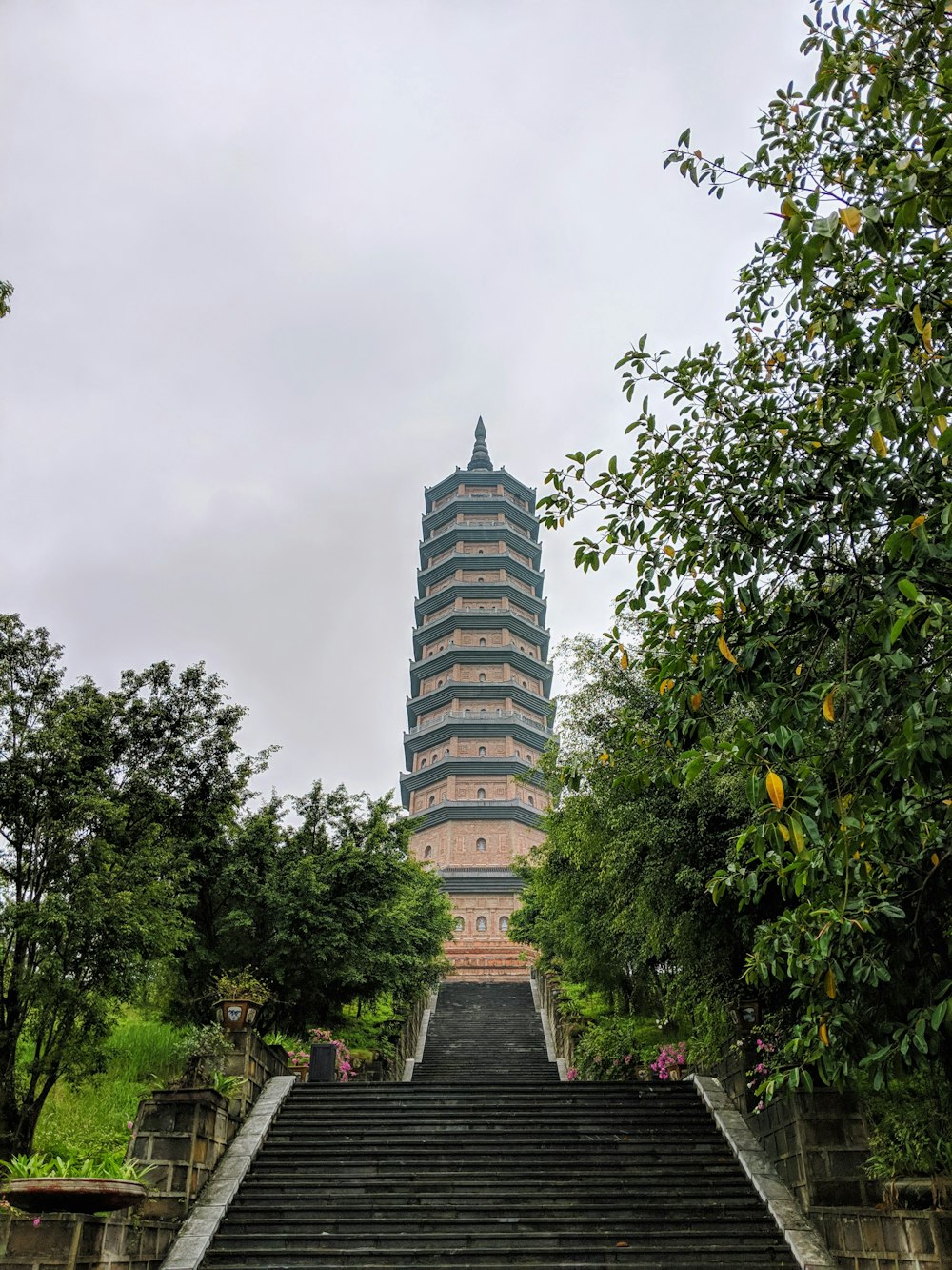 gray concrete tower under cloudy sky during daytime