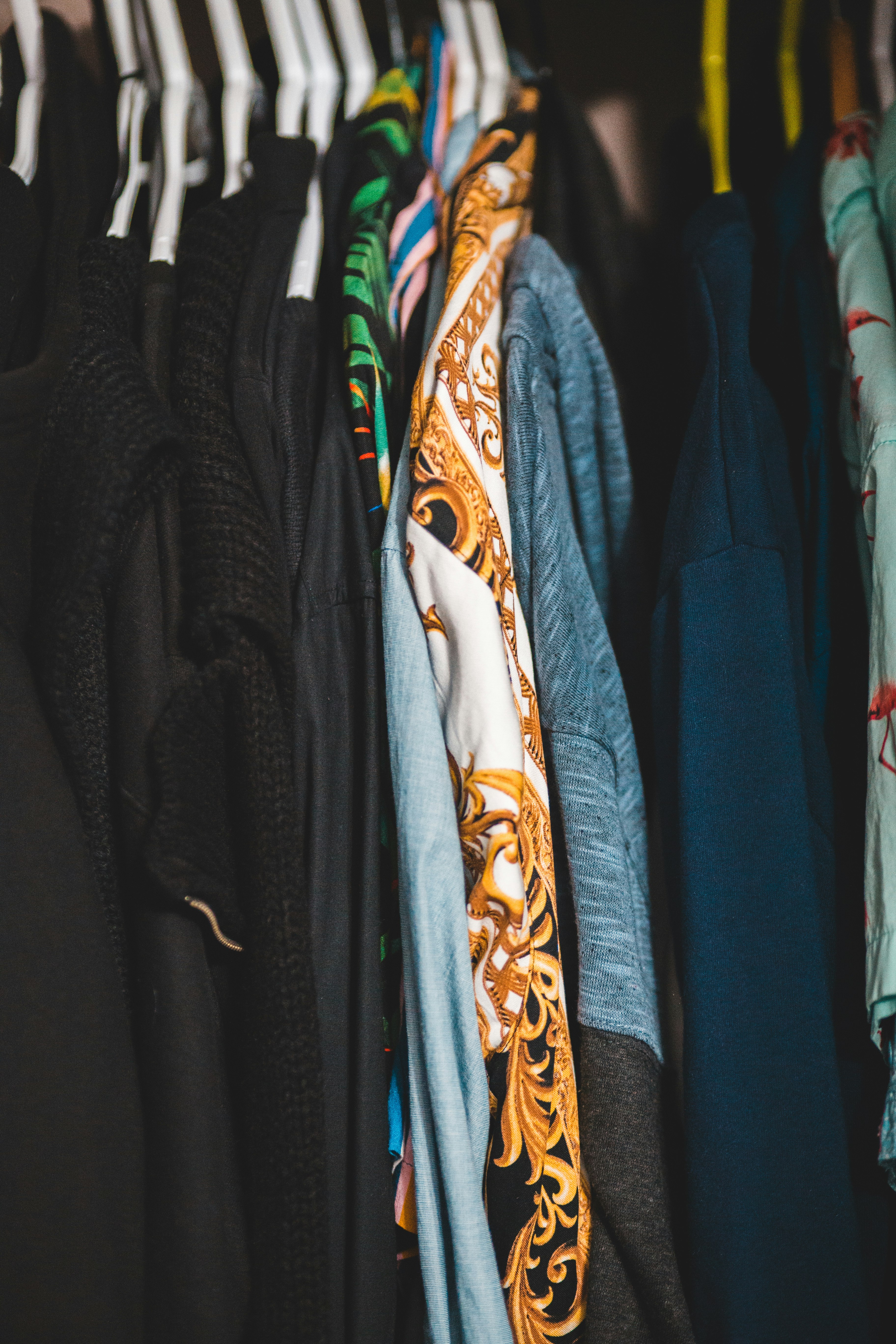 blue and brown clothes in closet