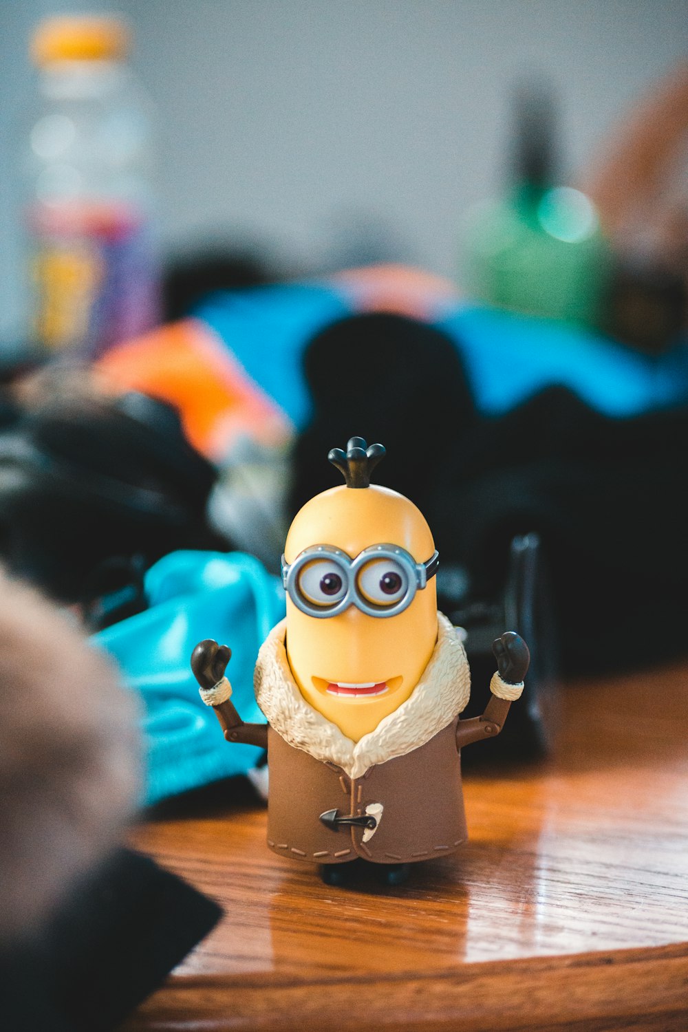 minion toy on brown wooden table