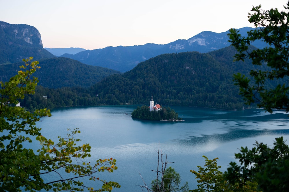 green mountains beside body of water during daytime