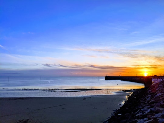 body of water under blue sky during sunset in Granville France