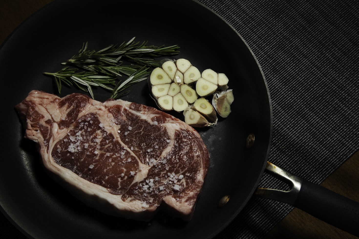 raw meat on black plate photo