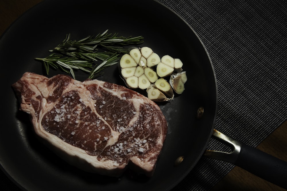 raw meat on black plate