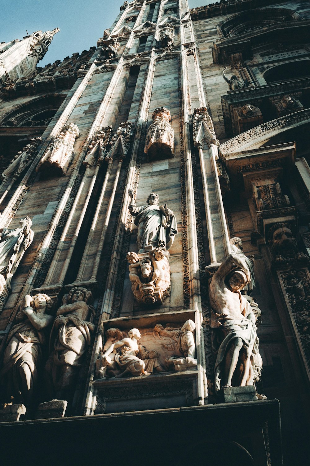 grayscale photo of concrete statues