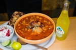 soup with meat in white ceramic bowl