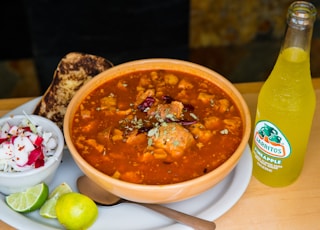 soup with meat in white ceramic bowl