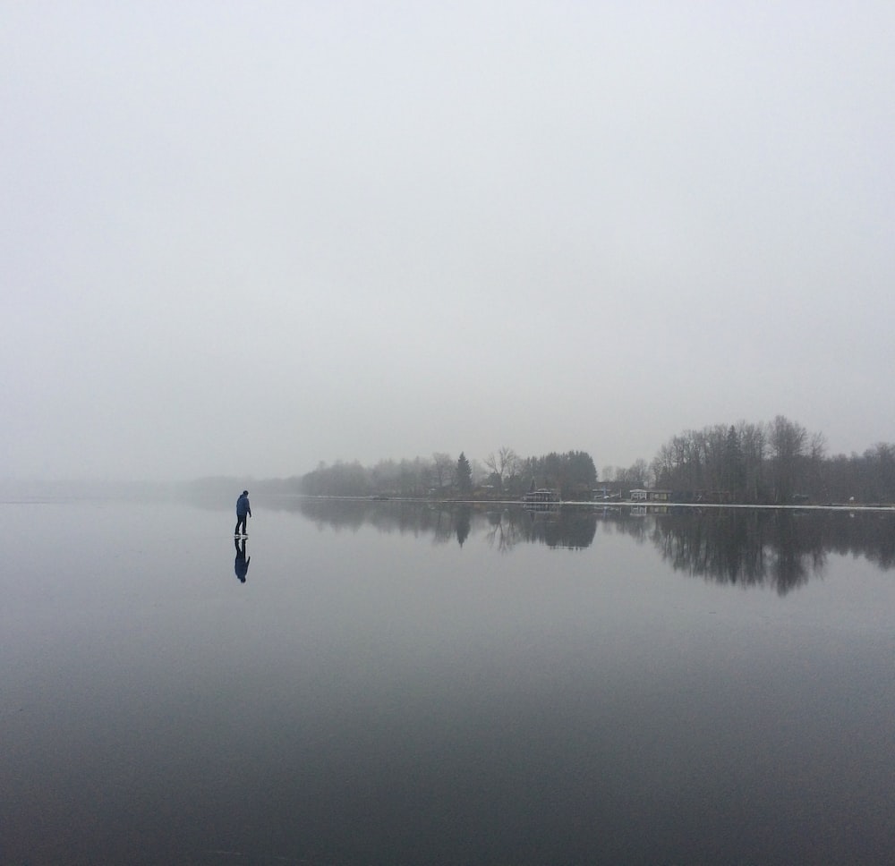 calm water under foggy sky