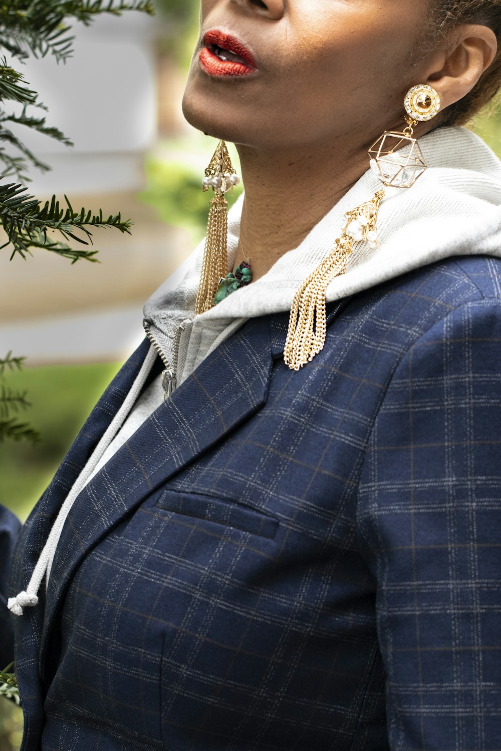 woman in blue and white plaid blazer