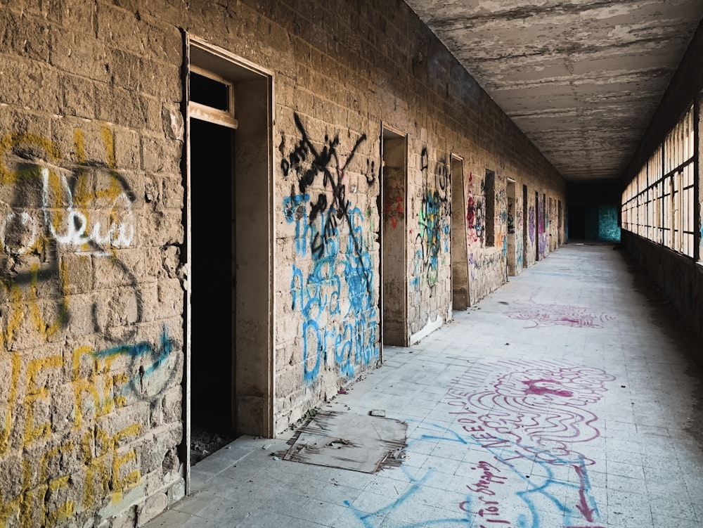 graffiti on brown brick wall