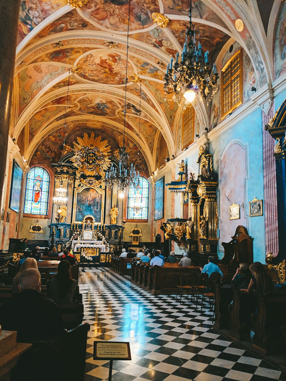 people sitting on chair inside cathedral