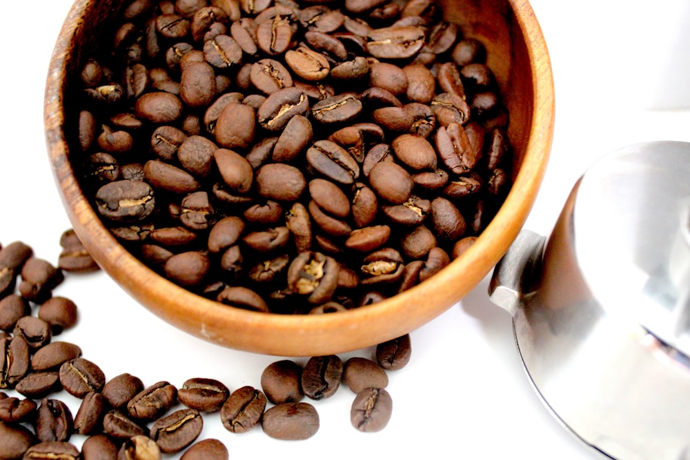 coffee beans in brown ceramic bowl