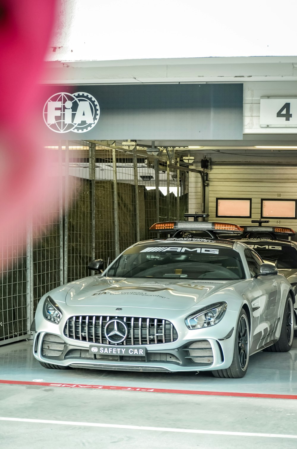 white mercedes benz coupe in garage