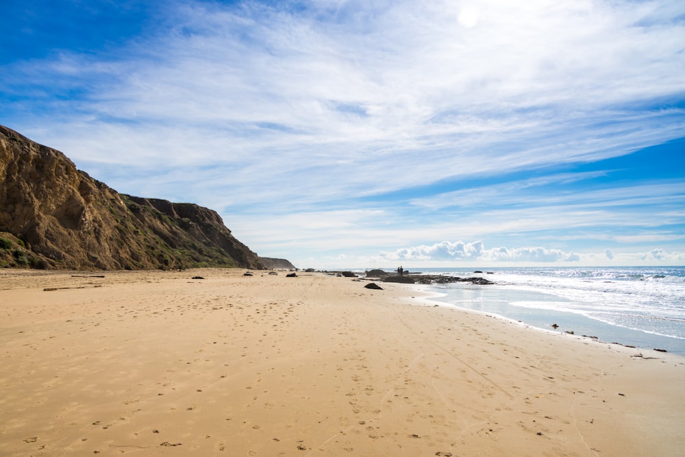 white sand beach during daytime