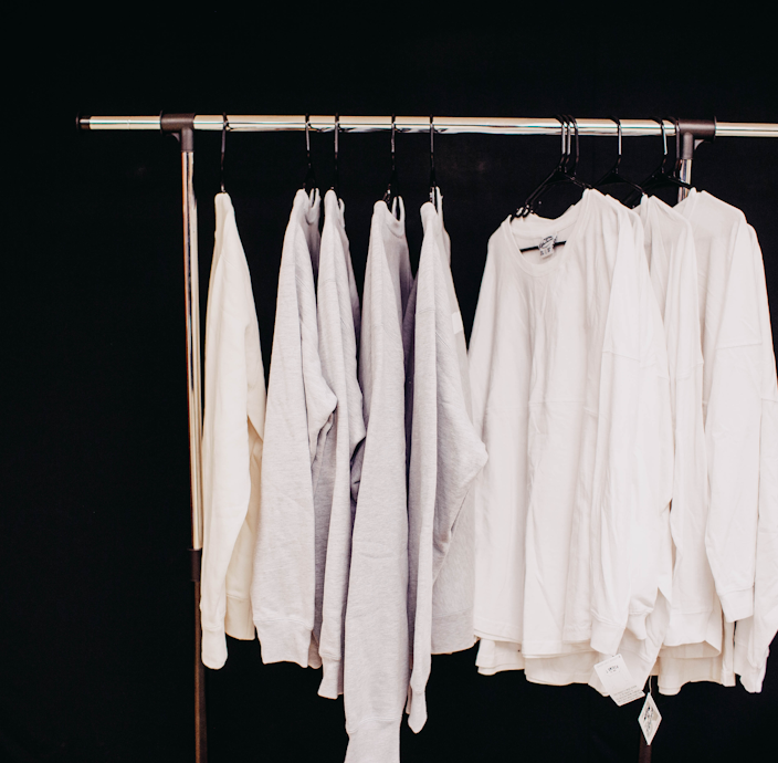 white dress shirt hanging on clothes hanger