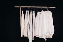 white dress shirt hanging on clothes hanger