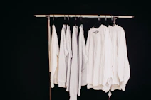 white dress shirt hanging on clothes hanger