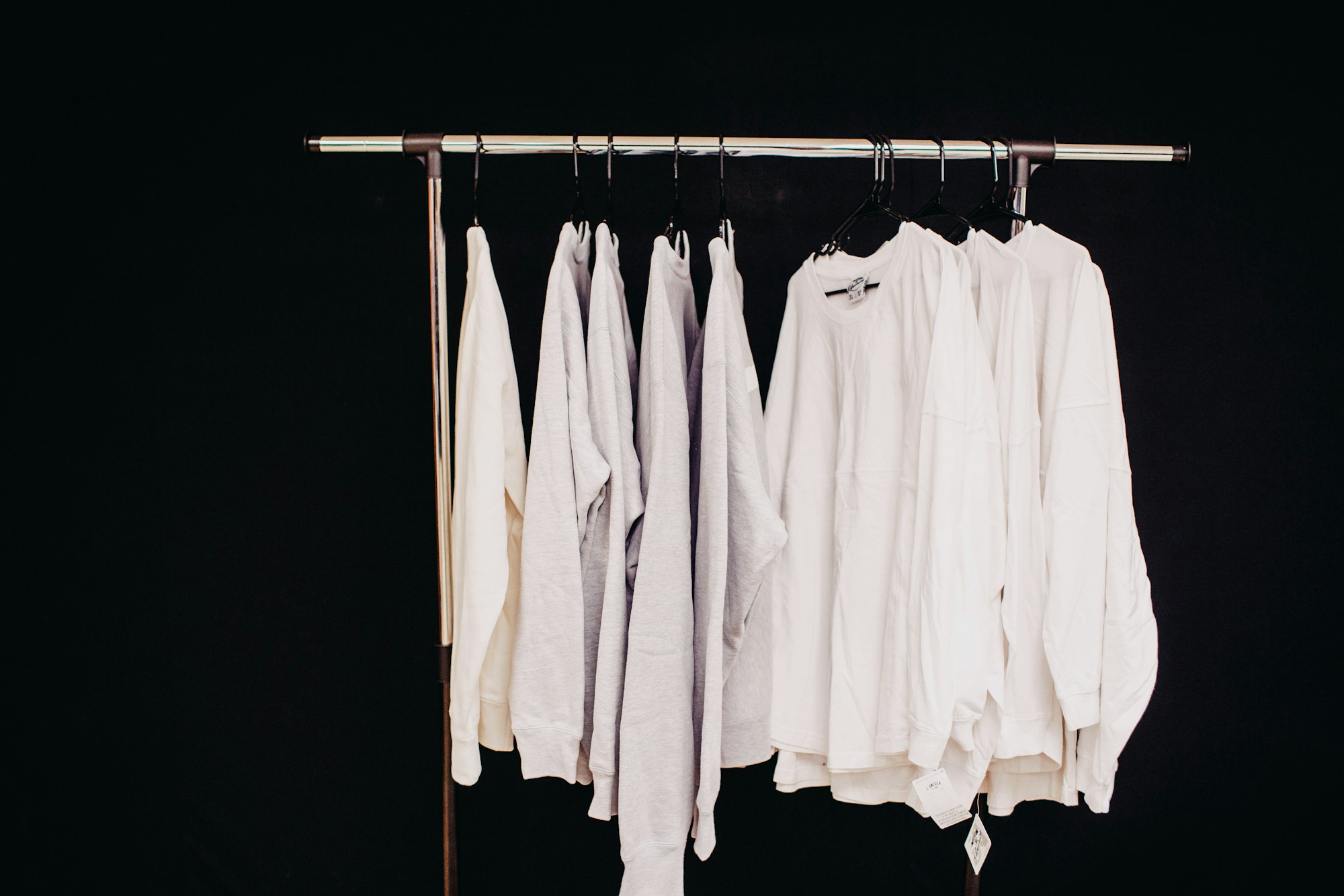 white dress shirt hanging on clothes hanger