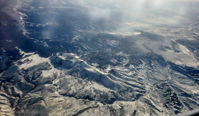 birds eye view of mountains covered with clouds aerial view teams background