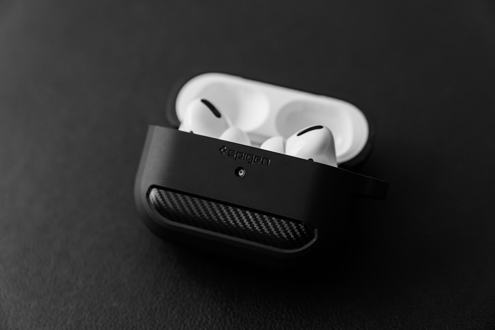 white apple earpods in black case