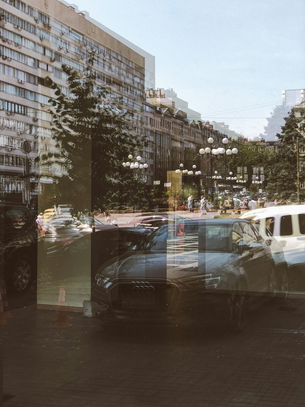 cars on road near buildings during daytime