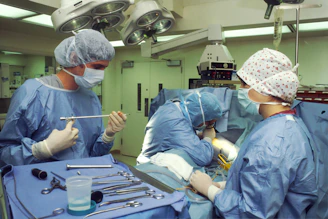 people in blue scrub suit sitting on chair
