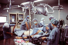 Team of medical professionals discussing a complex brain surgery case in a conference room