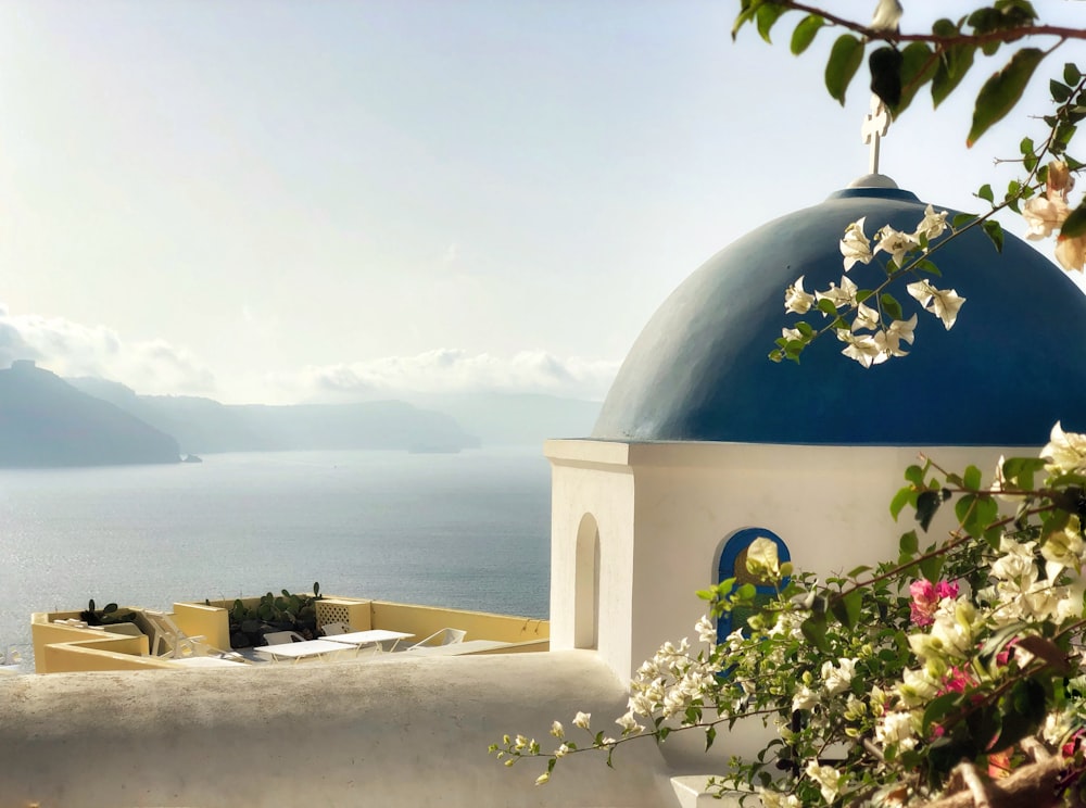 white and blue dome building near body of water during daytime