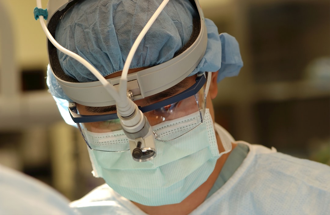 Surgeon wearing a mask during surgery.