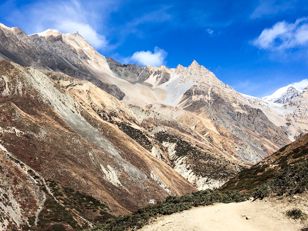 snow covered mountain under blue sky during daytime