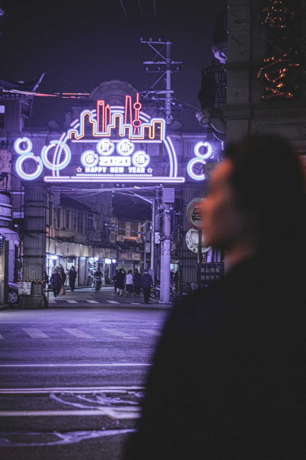 woman walking on street during night time