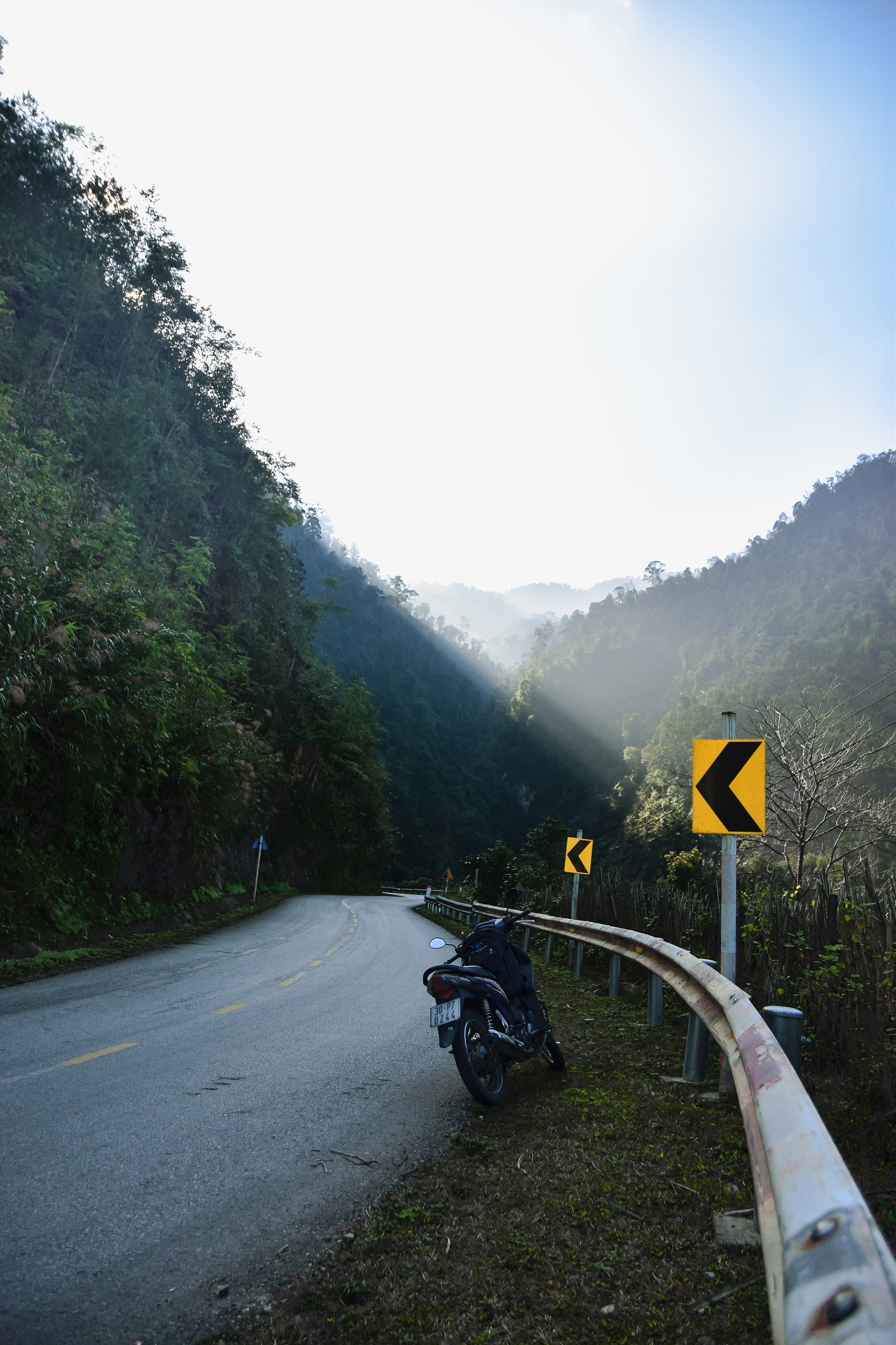 man riding motorcycle on road during daytime